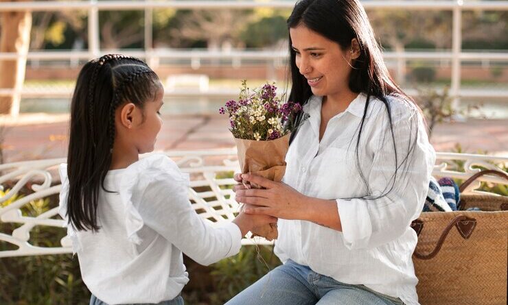 woman spending mothers day with her daughter outdoors park 23 2150293209