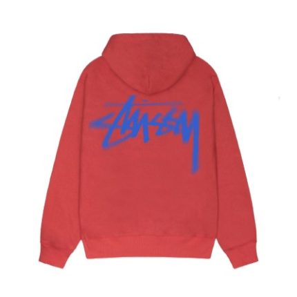 Bleu Stussy Hoodie showcasing stylish streetwear in vibrant blue against a Parisian backdrop.