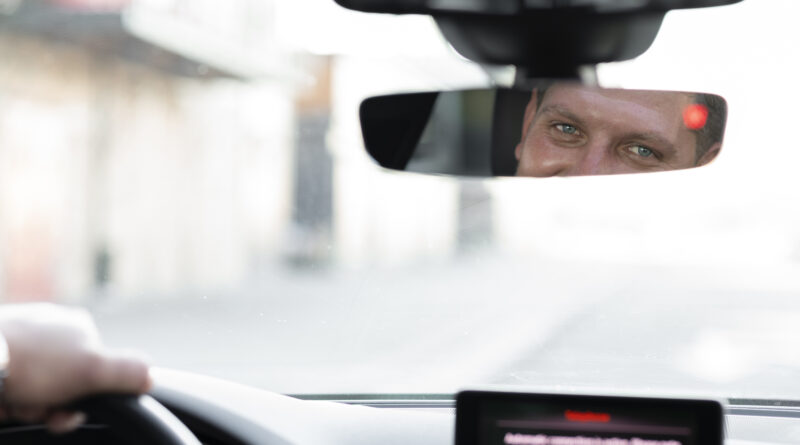 driver looking car mirror 1