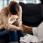 depressed woman seeking solace from her psychotherapist